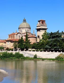 River Adige in Verona, Italy with old church on bank