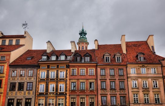 Image of colorful old houses in the main town square in Warsaw, Poland enhanced by use of HDR techniques