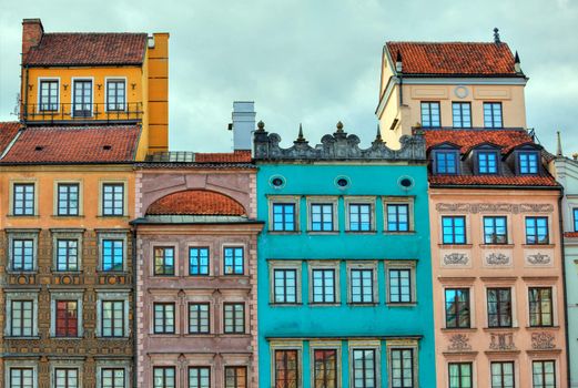 Image of colorful old houses in the main town square in Warsaw, Poland enhanced by use of HDR techniques
