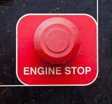 Engine stop button on heavy machinery