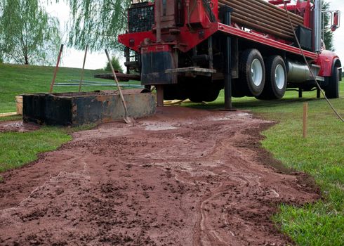 Drilling for geothermal power system in suburban yard