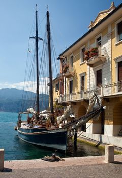 Sailing boat in the harbor of Malcesine on Lake Garda