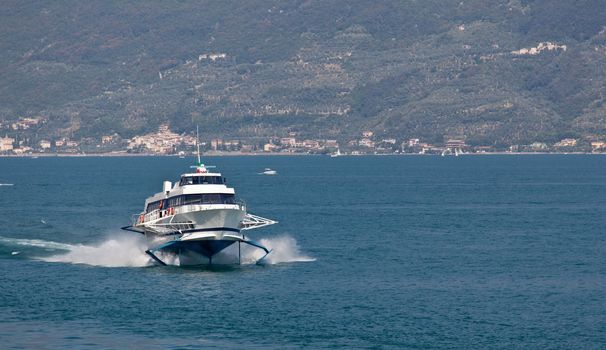 Ferry hydrafoil on Lake Garda Italy coming in to the port