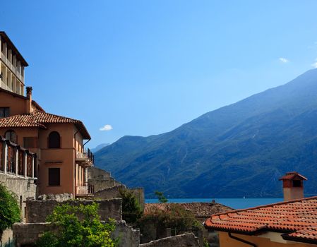 View to Lake Garda in Limone over the tiled rooftops