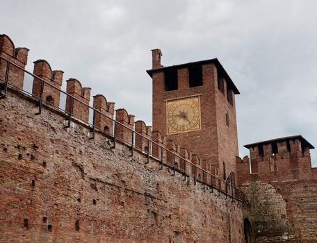 Castel Vecchio in Verona with battlements against the cloudy sky