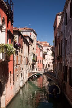 Backwater in Venice showing small canal and bridge