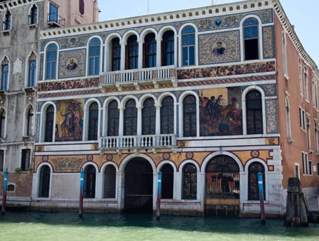 Old painted house by the Grand Canal in Venice