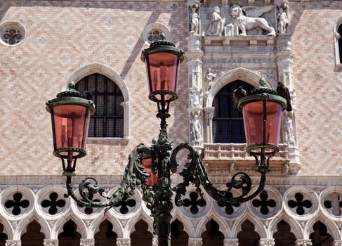Ornate lamp in front of Doge's palace in San Marco Venice