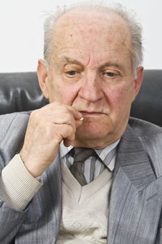 Portrait of a senior man taking his medication.