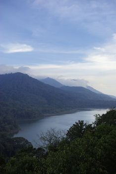 It's a view on one of four big lakes of Bali island, with lots of tropical forest