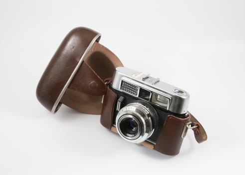 Old camera with open leather case on a white background