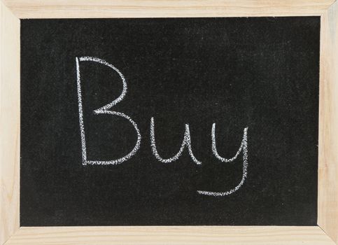 Black chalk board with wooden framed surround with the word Buy.