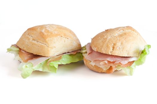 loaf of bread with jam, speck and lettuce isolated on white background