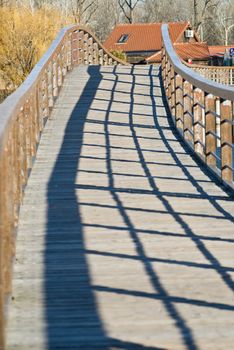 a bridge in bright sunlight with the balustrade throwing a shadow