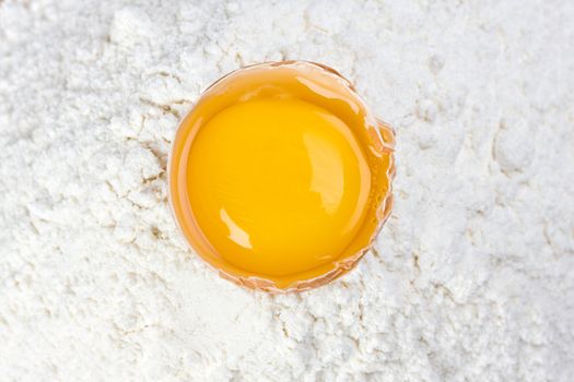 open egg on a bed of flour