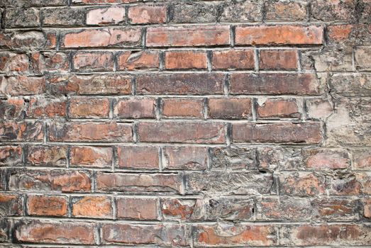 a close-up of an old aged red brickwall