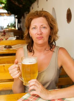 The young woman with a beer mug