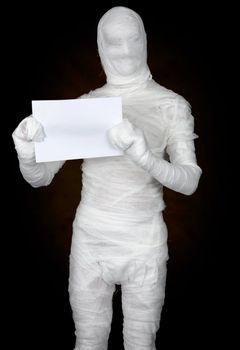 Mummy hold sheet of paper on the black