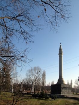 Monument, eternal flame, monument, laid, architectral building, styles, park, garden, place for rest and walks, tree, star, place of the worship, memory, blue sky, city