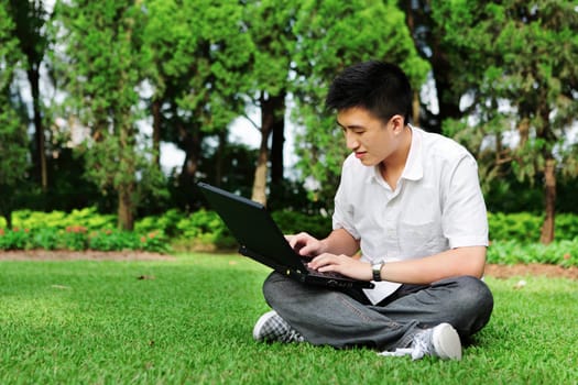 man using computer outdoor