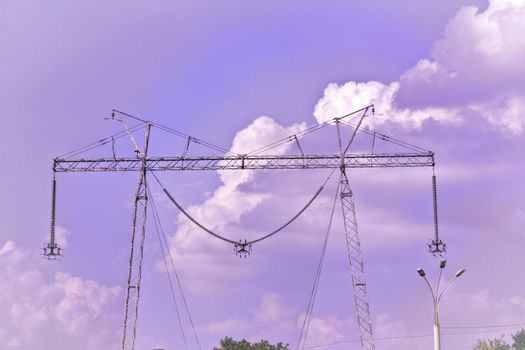 	
electrical powerlines with blue sky and white clouds