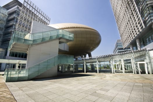 Bright outlook for business. Modern office block with sunny beautiful sky. 
