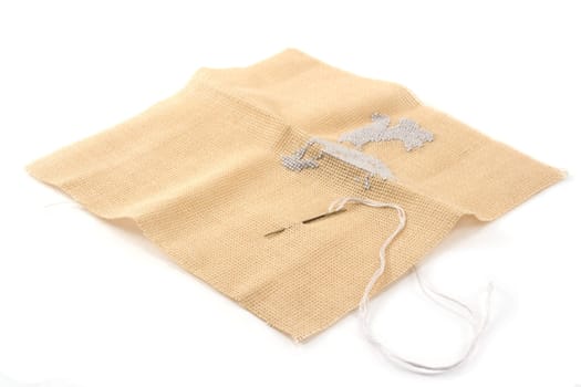 Fabrics, flax, needle with thread, embroidery, beige