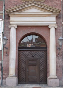ionic columns and semi-circular arched door        
