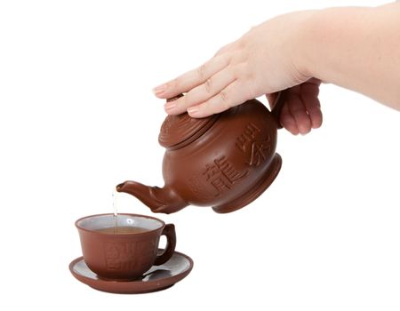 Teapot and mug on a white background. isolated image