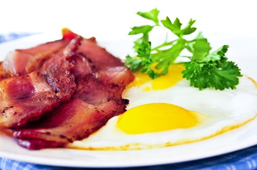 Tasty breakfast of bacon and fried eggs