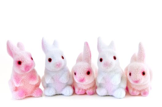 Cute Easter bunny toys isolated on white background