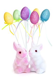 Cute Easter bunny toys and balloons isolated on white background