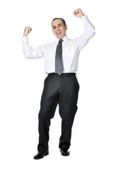 Happy celebrating business man in suit isolated on white background