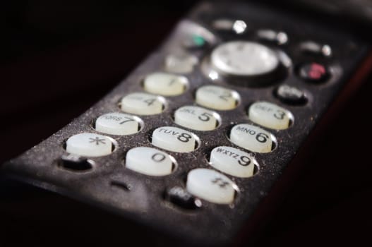 A close up of dusty keypad of phone