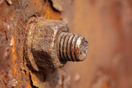 The rusted old iron nut which can't be turned off