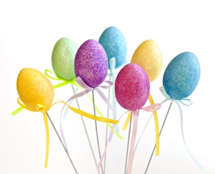 Cute Easter toy eggs isolated on white background