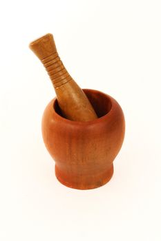 Cooking utensil : Wooden mortar and pestle isolated on white background. Can be used in a pharmacy or for cooking  