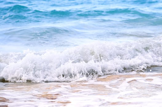Tropical Caribbean sea waves breaking on the shore