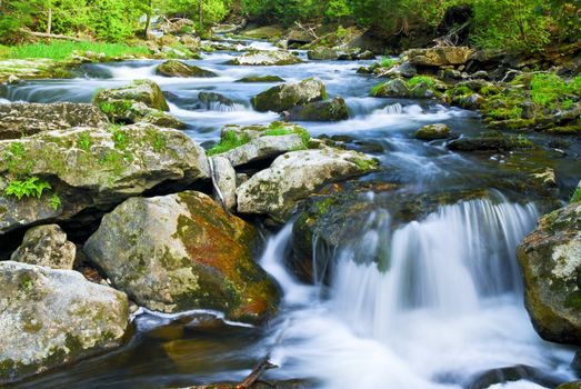 Water rushing among rocks in river rapids in Ontario Canada