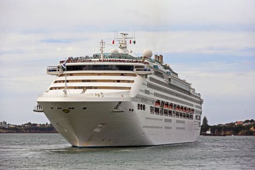 luxury white cruise ship at harbor on a sky