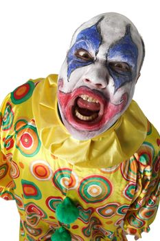 A nasty evil clown, angry and looking mean. Harsh lighting from below.