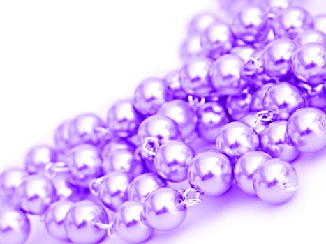 Purple pearl necklace on a white background.
