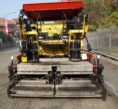 Road works with asphalt machine