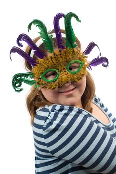 A portrait of a young girl wearing a feather mask, isolated against a white background