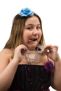 A young girl all decked out showing off her bling, isolated against a white background