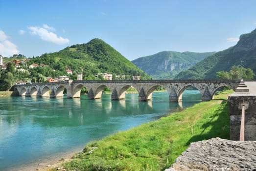 Famous bridge on the Drina in Visegrad, Bosnia and Herzegovina, on a hot summer day.
