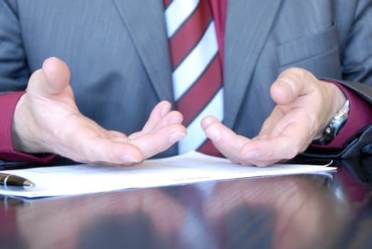 businessman hands on desk gesticulation
