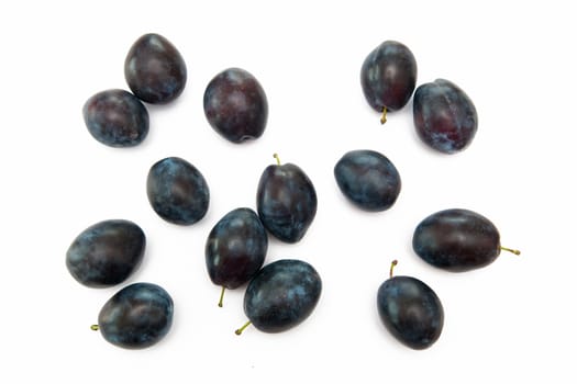 Plums on the white background