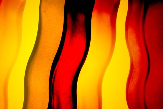 Abstract color background of backlit color glass.