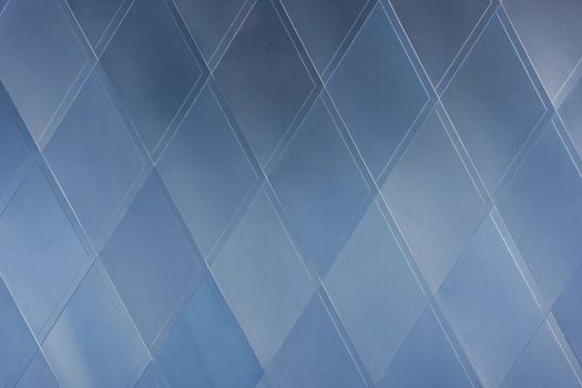 architecture abstract - blue building exterior with geometrical rhomb  pattern